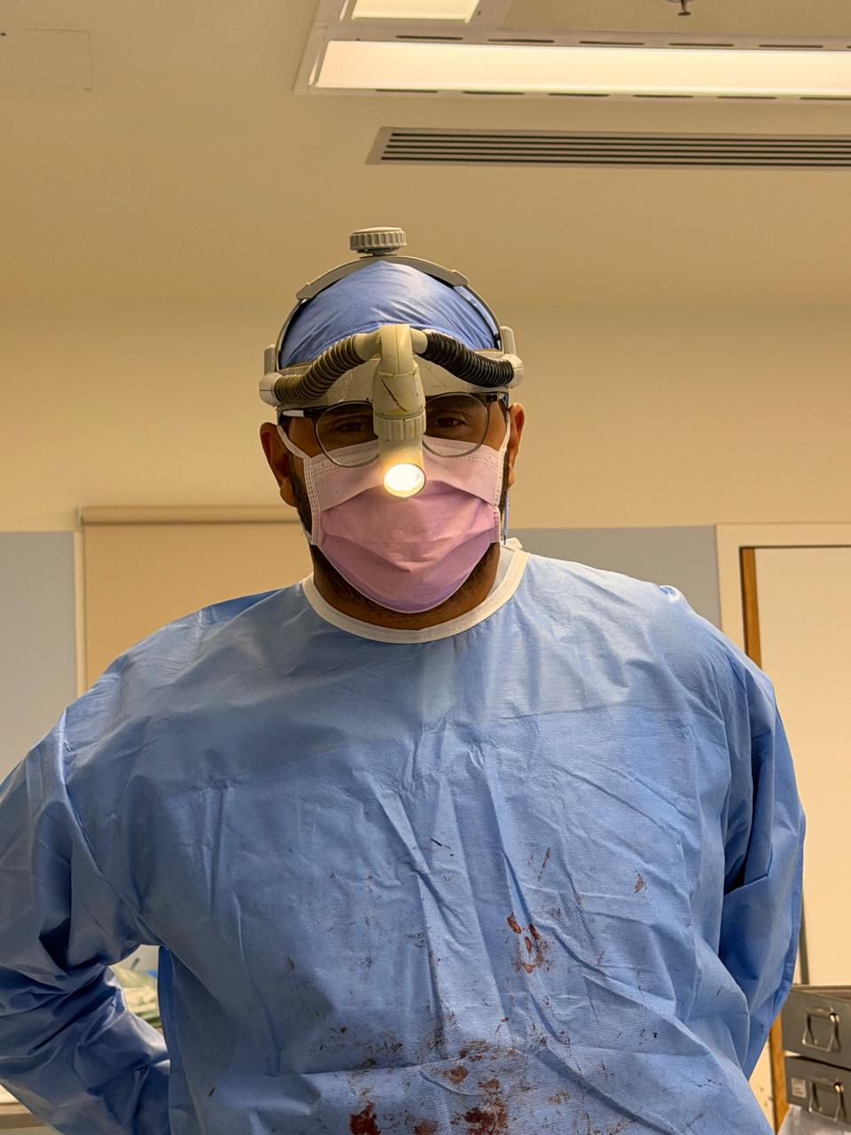 Dr. Mohamad El Haress providing surgical care